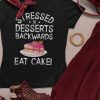 Stressed Is Desserts Backwards Eat Cake Unisex Jersey Short Sleeve Tee - flat lay mockup of a t shirt and a cool outfit - Shujaa Designs