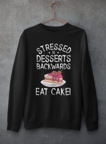Stressed Is Desserts Spelled Backwards Eat Cake Unisex Heavy Blend™ Crewneck Sweatshirt - mockup of a customizable crewneck sweatshirt hanging against a concrete wall - Shujaa Designs